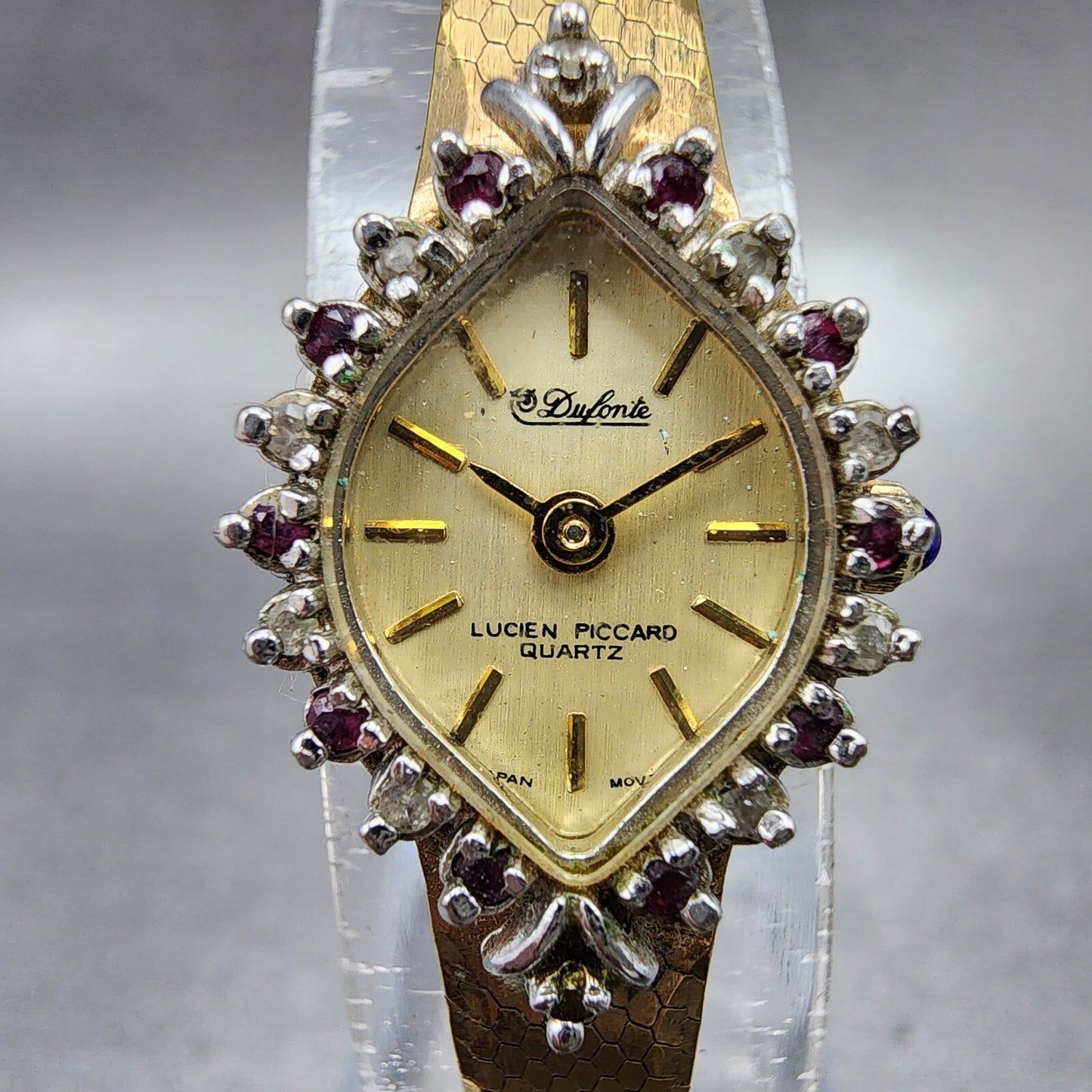 Lucien Piccard Dufonte Watch Women 14mm Champagne Dial Gold Tone Ruby Bezel Runs