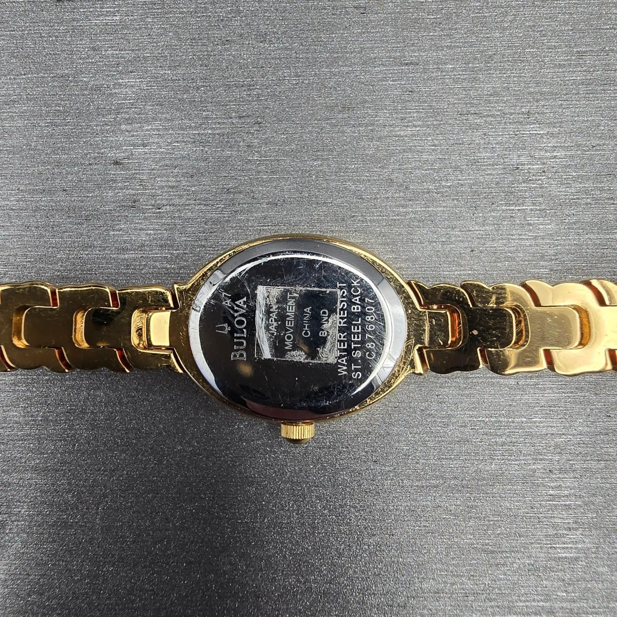 Bulova Watch Women 17mm White Dial Gold Tone Oval Gemmed 97V23 New Battery10