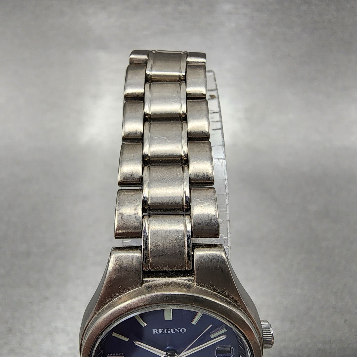 Reguno Solar Watch Women 25mm Blue Dial Titanium Date E011-S028132 Runs