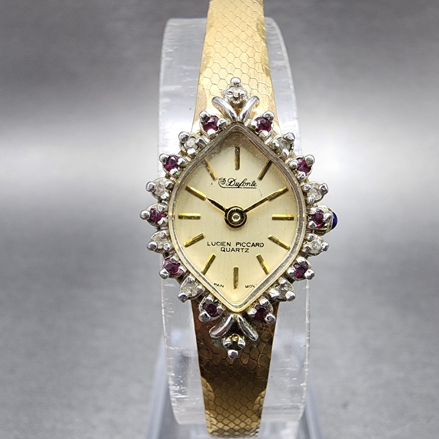 Lucien Piccard Dufonte Watch Women 14mm Champagne Dial Gold Tone Ruby Bezel Runs