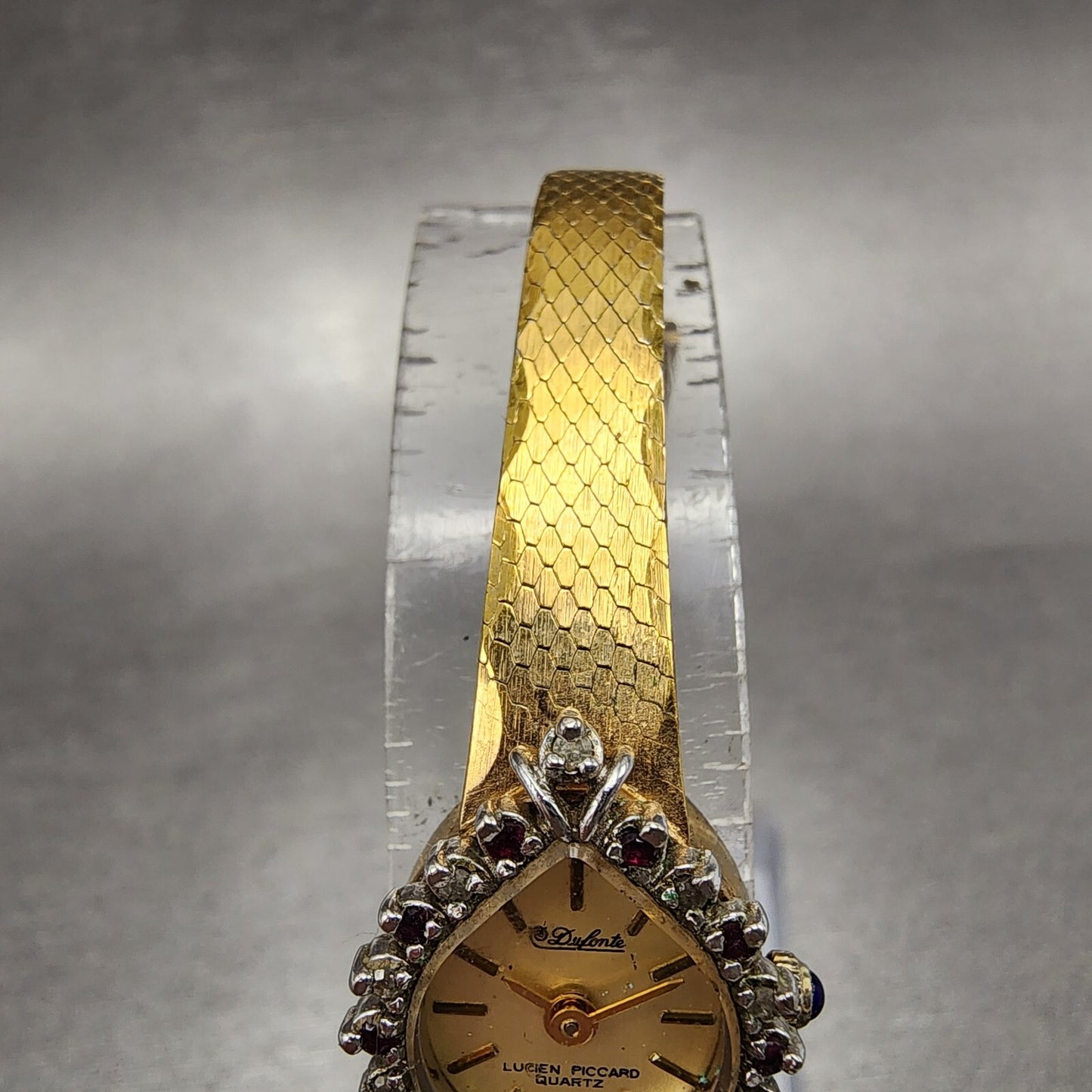 Lucien Piccard Dufonte Watch Women 14mm Champagne Dial Gold Tone Ruby Bezel Runs