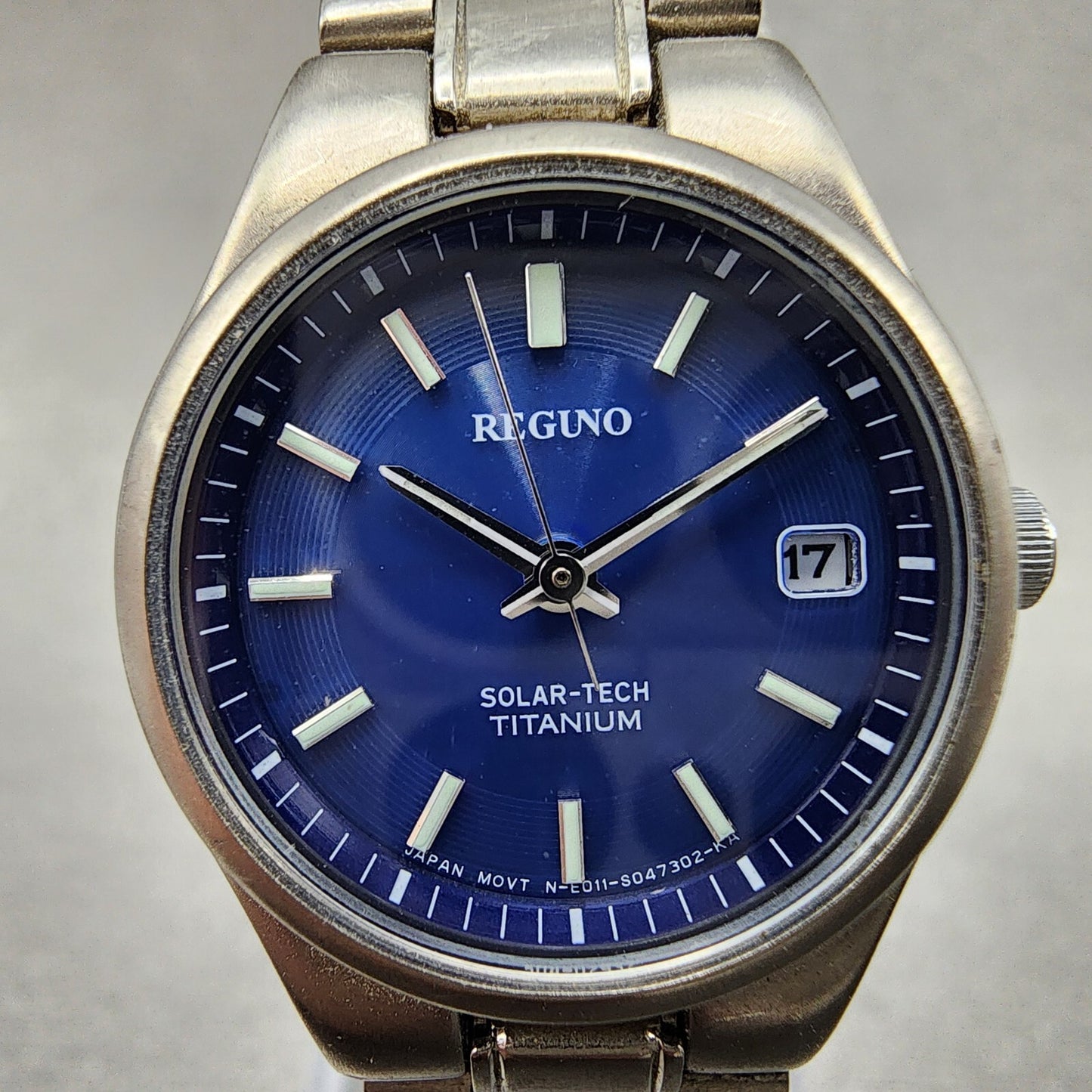 Reguno Solar Watch Women 25mm Blue Dial Titanium Date E011-S028132 Runs
