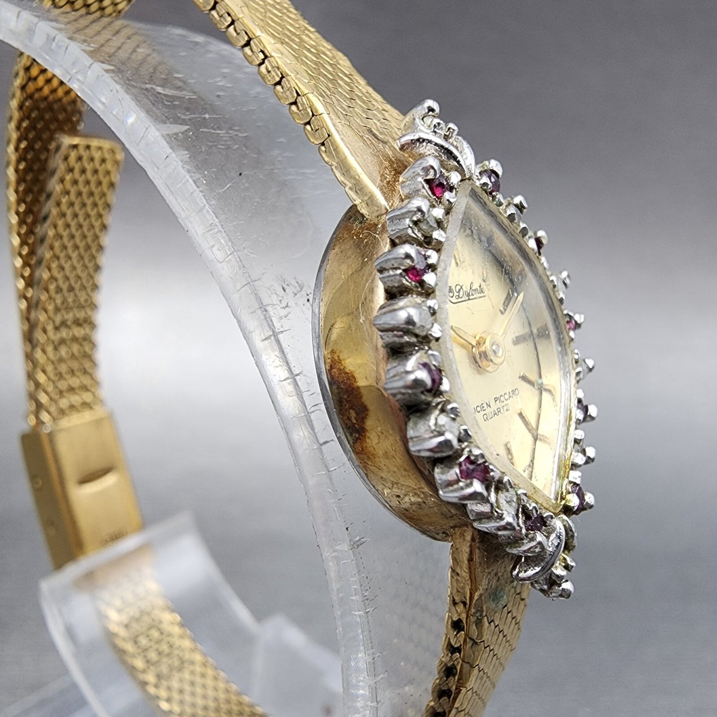 Lucien Piccard Dufonte Watch Women 14mm Champagne Dial Gold Tone Ruby Bezel Runs
