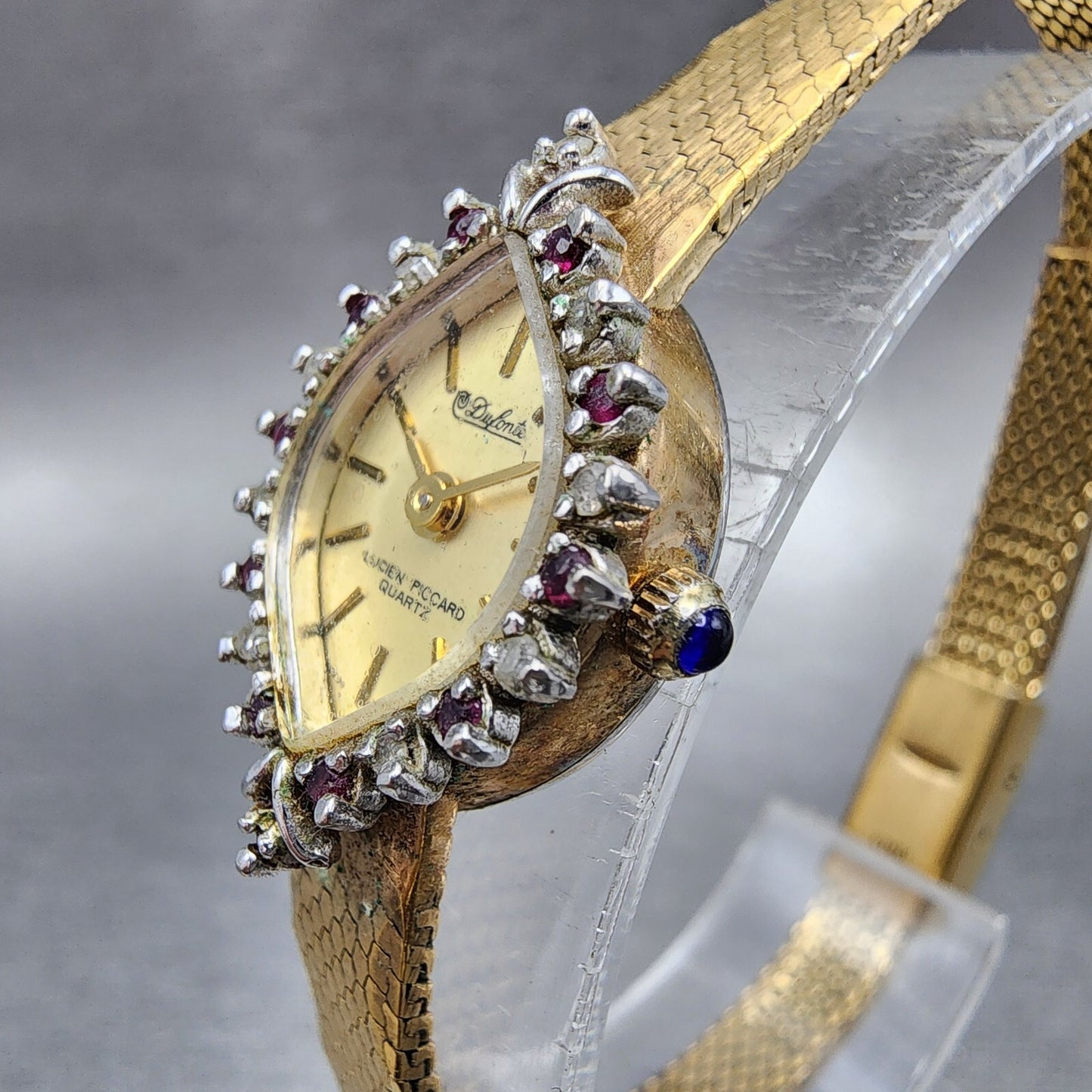 Lucien Piccard Dufonte Watch Women 14mm Champagne Dial Gold Tone Ruby Bezel Runs