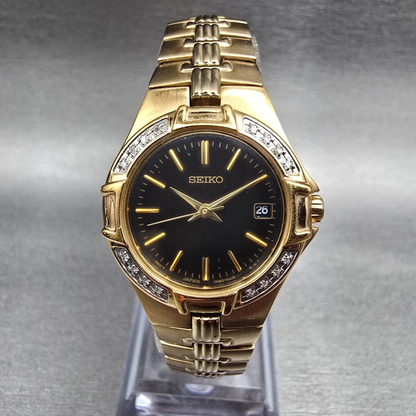 Seiko Watch Women 25mm Black Dial Gold Tone Date Diamonds 7N82-0DT0 New Battery0