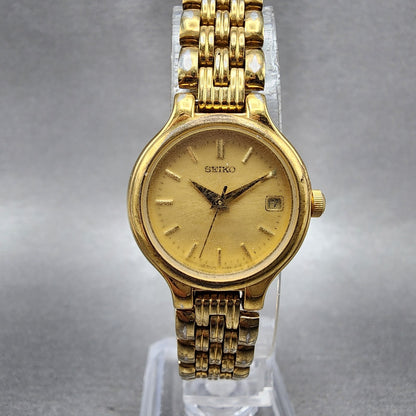 Seiko Watch Women 23mm Champagne Dial Gold Tone Date Round 7N820228 New Battery0