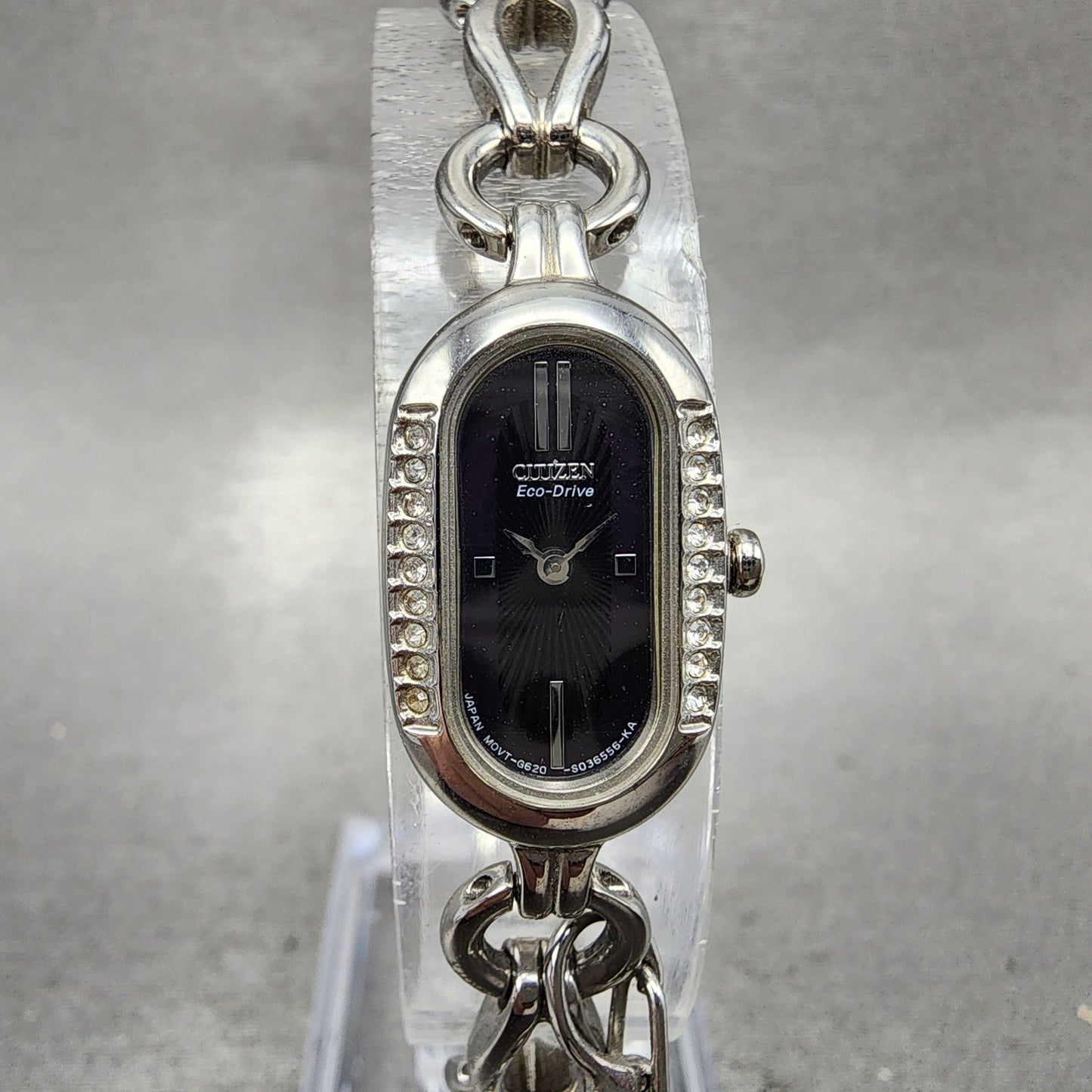 Citizen EcoDrive Watch Women 14mm Black Dial Silver Tone Oval Crystal Bezel0