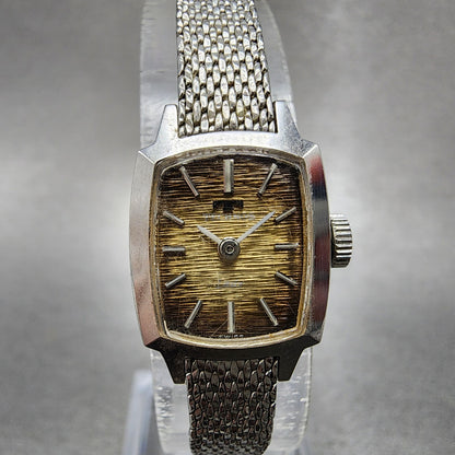 Technos Tank Watch Women 16mm Gold Dial Silver Tone Rectangle Manual Wind Runs0