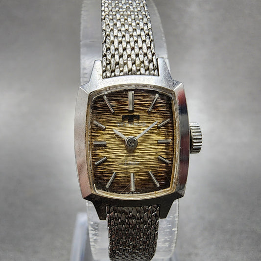 Technos Tank Watch Women 16mm Gold Dial Silver Tone Rectangle Manual Wind Runs0