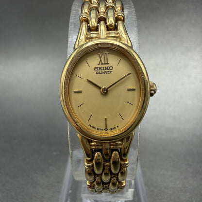 Seiko Watch Women 17mm Champagne Dial Gold Tone Oval 2P20-5B09 New Battery0