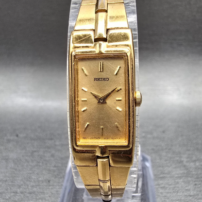 Seiko Tank Watch Women 13mm Gold Dial Gold Tone Rectangle 2E20-7479 New Battery50
