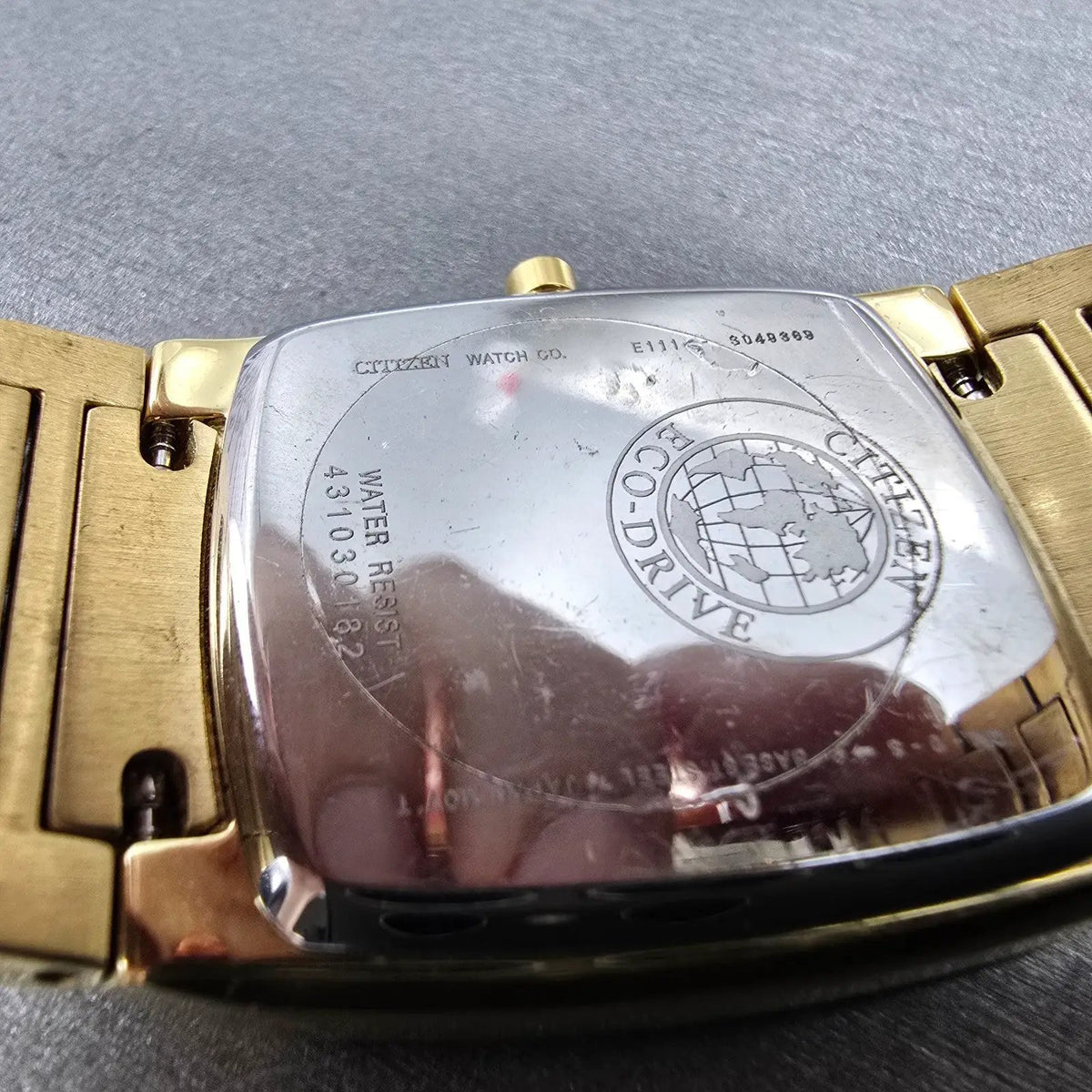 Citizen Eco-Drive Tank Watch Men 31mm Black Dial Gold Date E111-S049369 Runs RT9