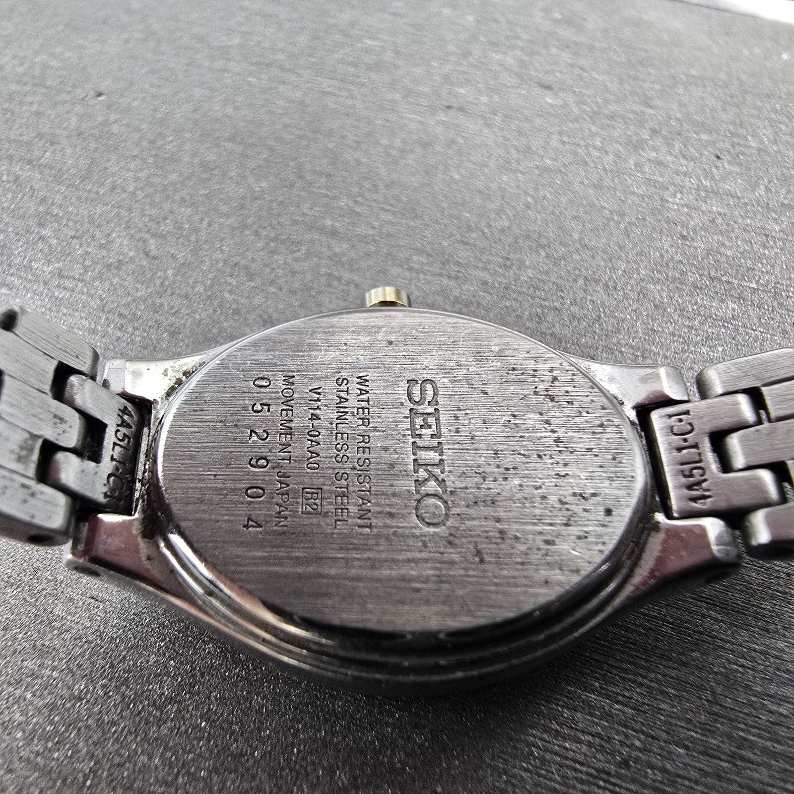 Seiko Solar Watch Women 20mm Black Dial Two Tone Oval V114-0AA0 Runs9