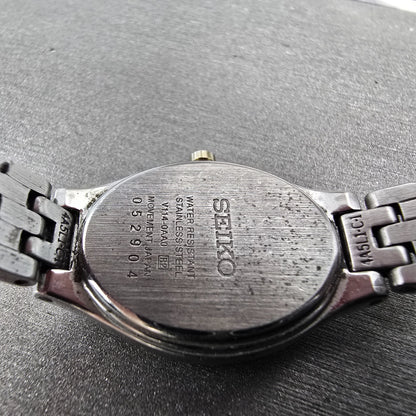 Seiko Solar Watch Women 20mm Black Dial Two Tone Oval V114-0AA0 Runs9