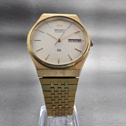 Seiko SQ Watch Men 33mm Champagne Dial Gold Tone Daydate Round 8223-7089 New Bat5