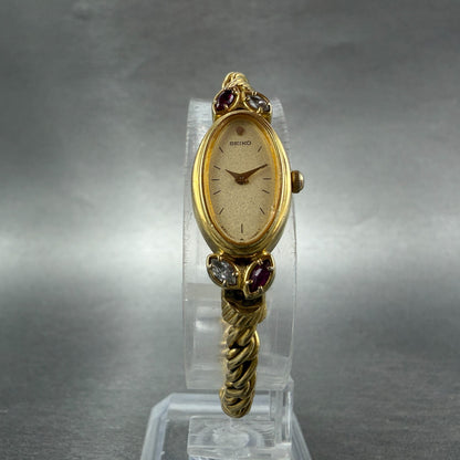 Seiko Watch Women 13mm Champagne Dial Gold Tone Oval 1E20-5760 New Battery Gems5