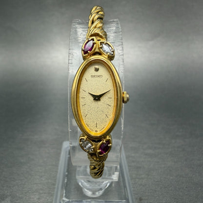 Seiko Watch Women 13mm Champagne Dial Gold Tone Oval 1E20-5760 New Battery Gems0