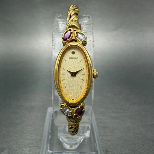 Seiko Watch Women 13mm Champagne Dial Gold Tone Oval 1E20-5760 New Battery Gems0
