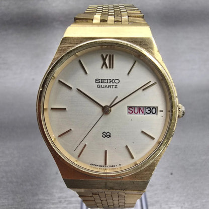 Seiko SQ Watch Men 33mm Champagne Dial Gold Tone Daydate Round 8223-7089 New Bat0