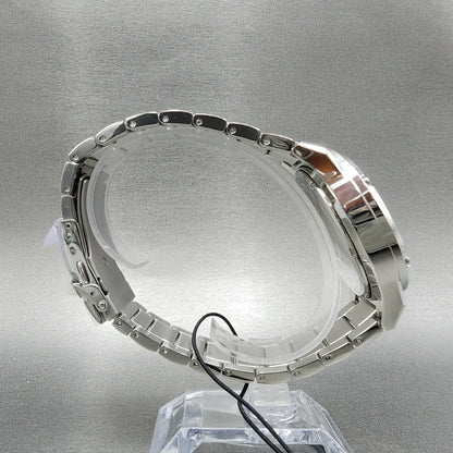 Stainless steel wristwatch side view on display stand, silver metal watch band