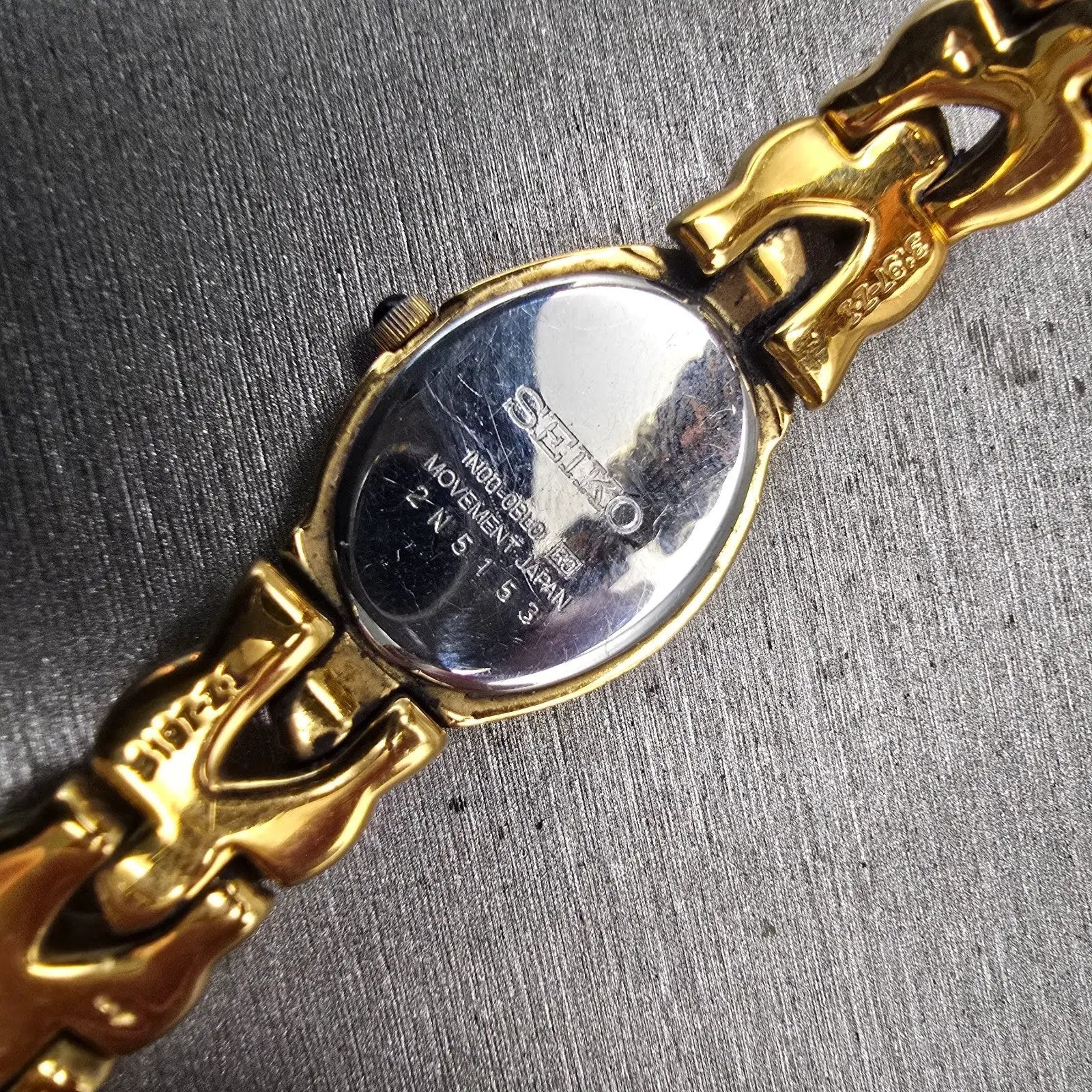 Seiko Watch Women 18mm Champagne Dial Gold Tone Oval 1N00-0BL0 New Battery VTG10