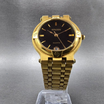 Gruen Watch Unisex 31mm Black Dial Gold Tone Date Round 225-6M12 New Battery5