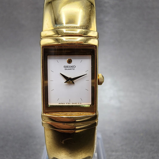 Seiko Watch Women 15mm White Dial Gold Tone Rectangle 1F205K19 New Battery0