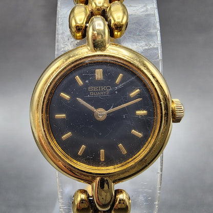 Seiko Watch Women 18mm Black Dial Gold Tone Round 1F200A29 New Battery VTG1