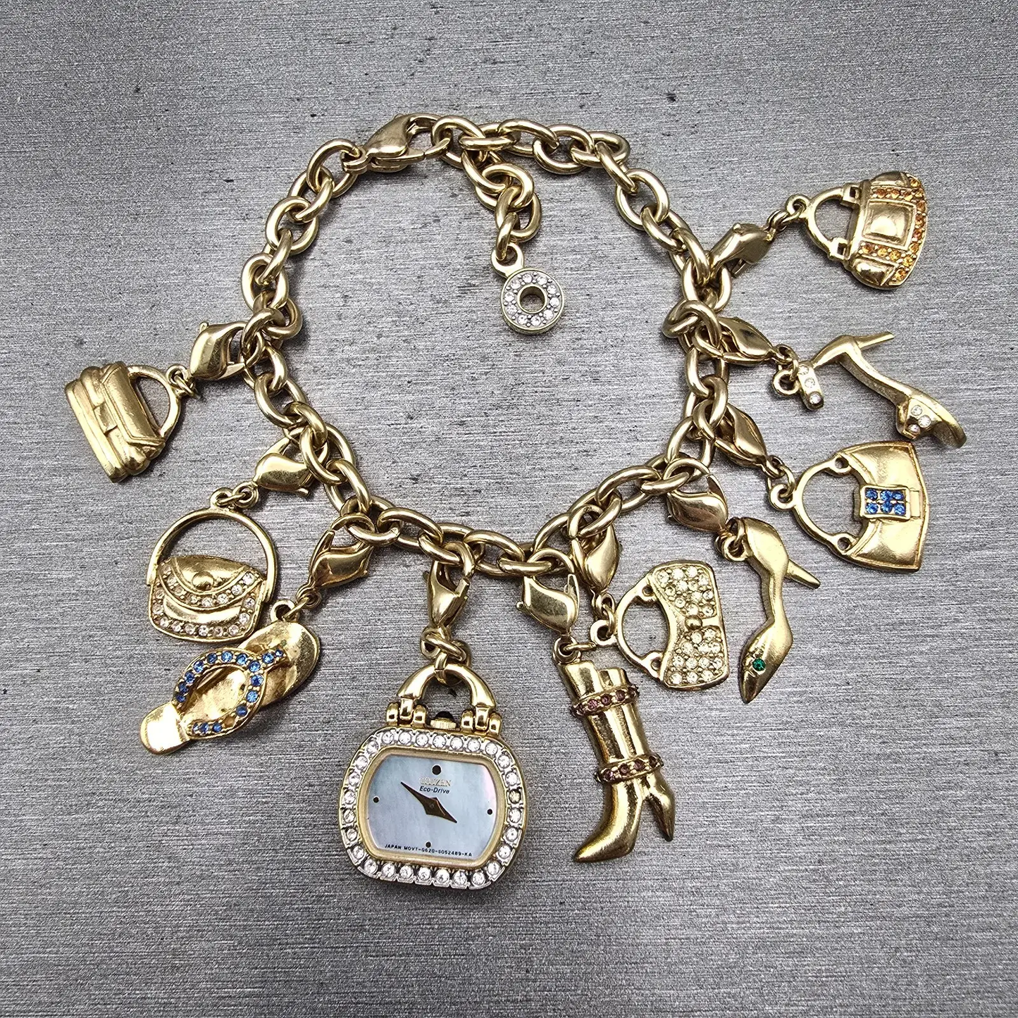 Citizen Eco-Drive Charm Bracelet Watch Women 20mm MOP Dial G620-S031117 Works0