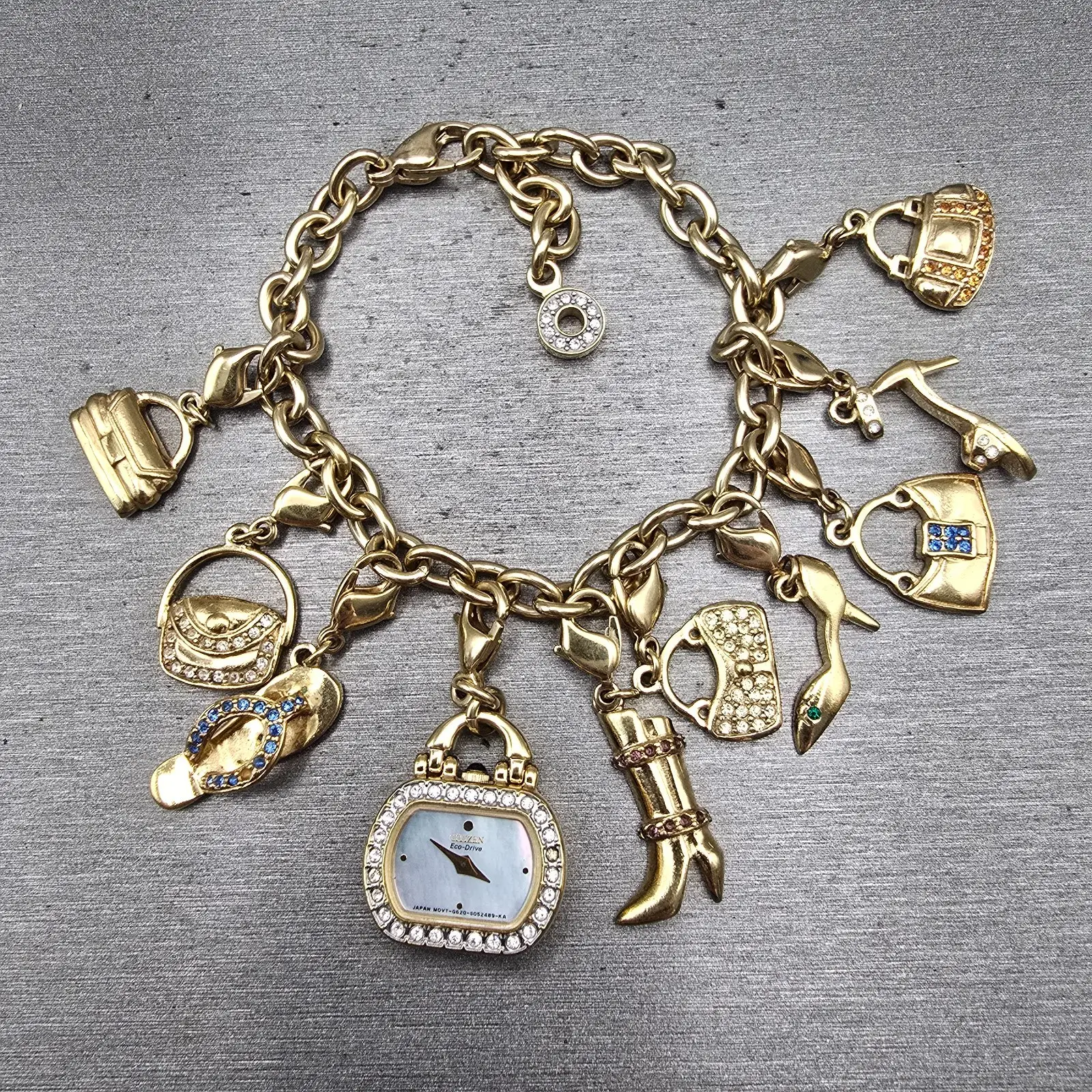 Citizen Eco-Drive Charm Bracelet Watch Women 20mm MOP Dial G620-S031117 Works0