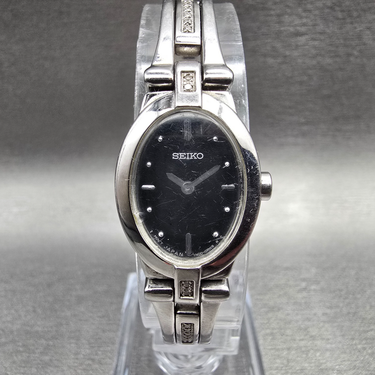 Seiko Watch Women 17mm Black Dial Silver Tone Oval 1N00-0KG0 New Battery0