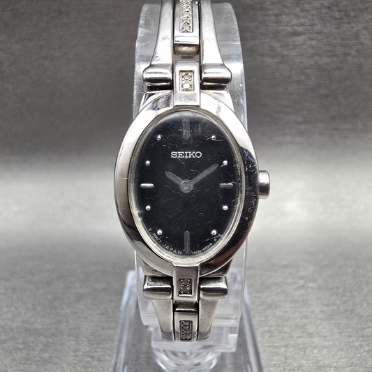 Seiko Watch Women 17mm Black Dial Silver Tone Oval 1N00-0KG0 New Battery0