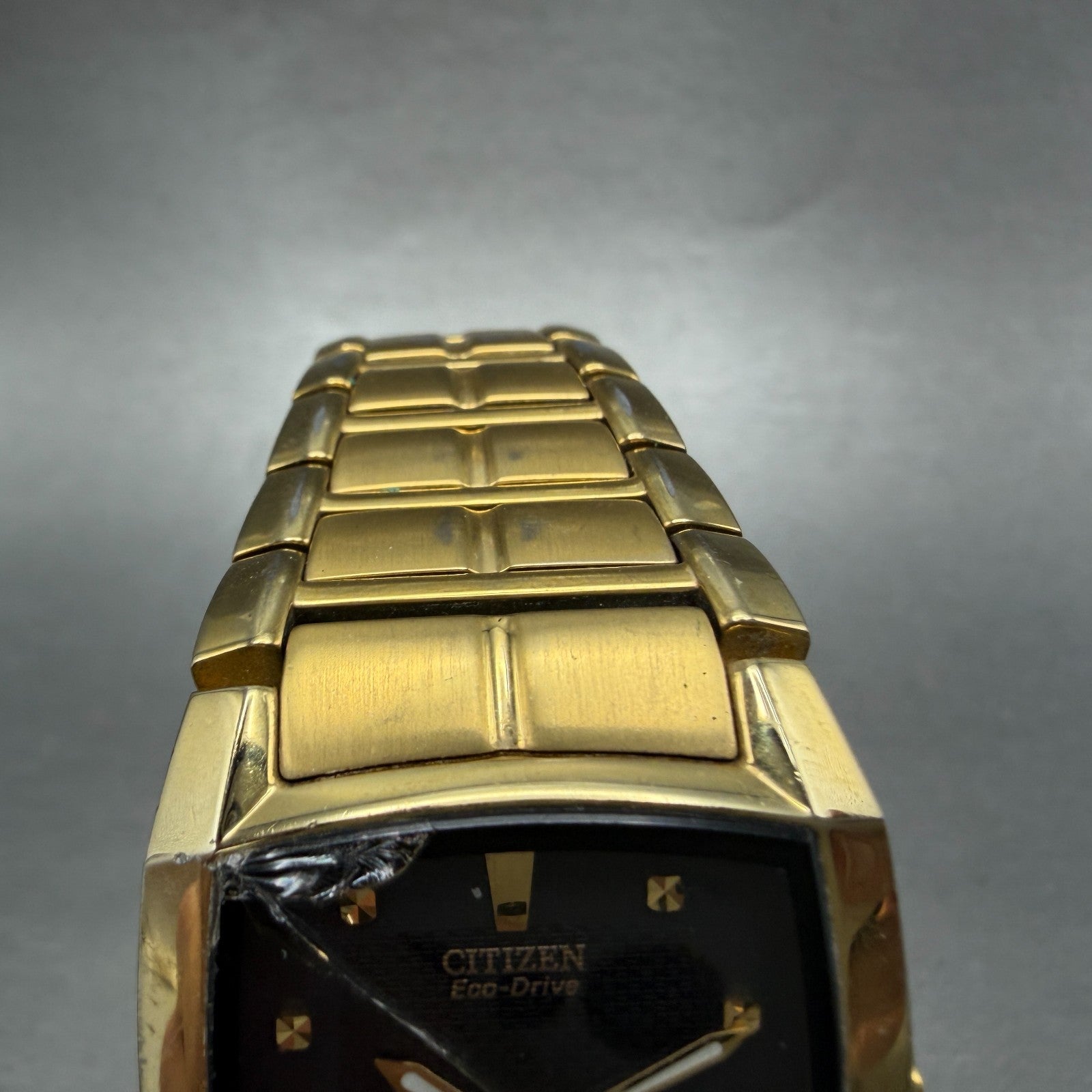 Citizen Eco-Drive Tank Watch Men 31mm Black Dial Gold Tone Date E111-S049369 Run4