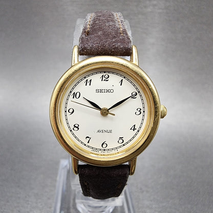 Seiko Avenue Watch Women 23mm White Dial Gold Tone Round 1F210C40 New Battery0