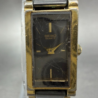 Seiko Tank Watch Women 13mm Black Dial Black & Gold Tone 1E20-551H New Battery1