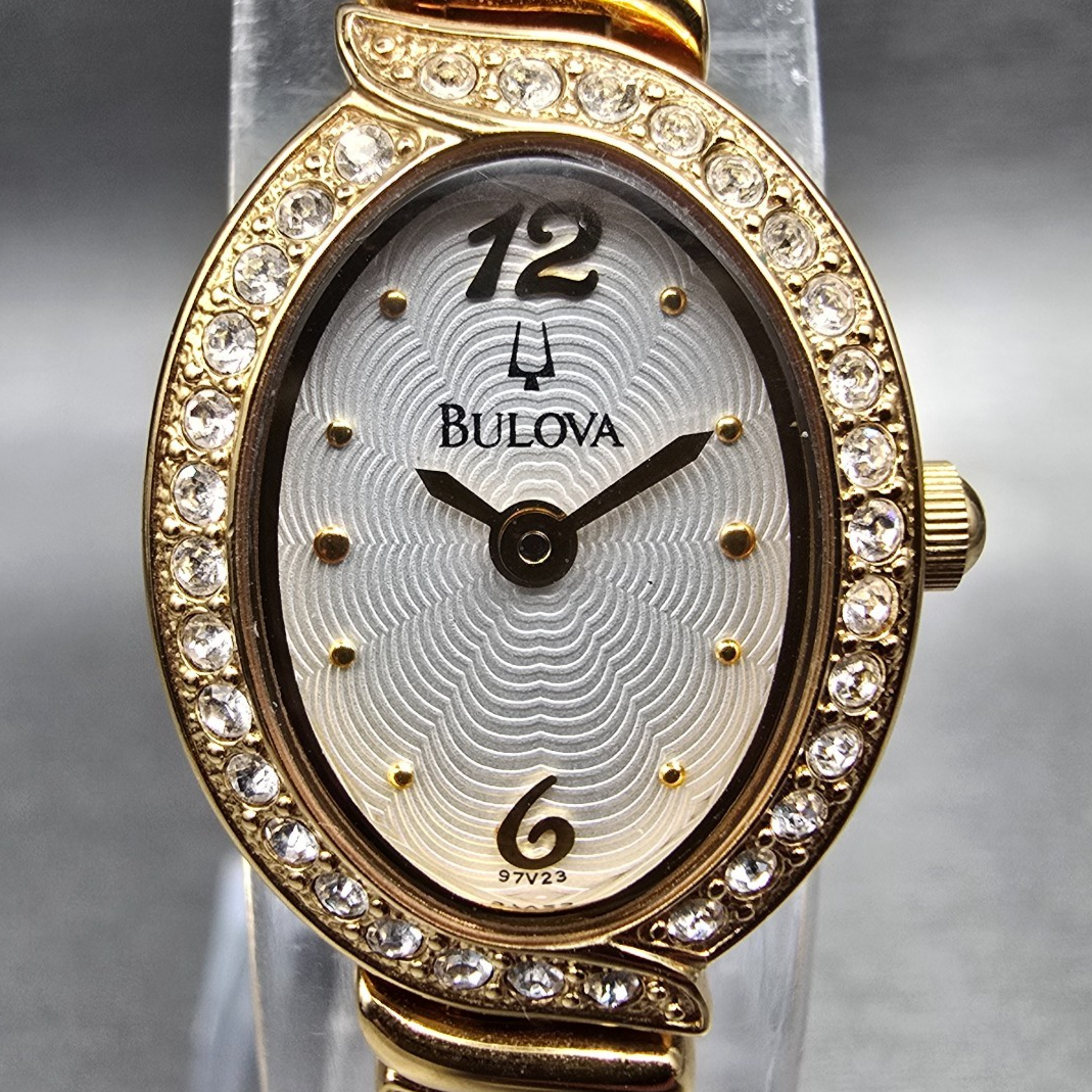 Bulova Watch Women 17mm White Dial Gold Tone Oval Gemmed 97V23 New Battery1