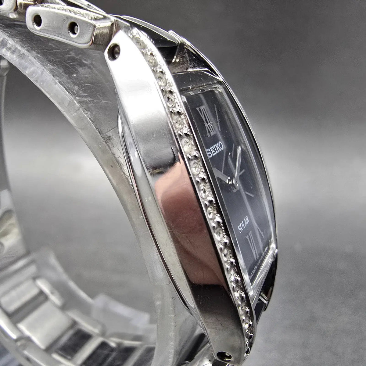 Seiko Solar Watch Women 19mm Black Dial Black Silver Crystal Bezel V115-0AY03