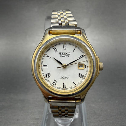 Seiko SQ 100 Watch Women 28mm White Dial Gold Tone Date 7N82-0061 New Battery0