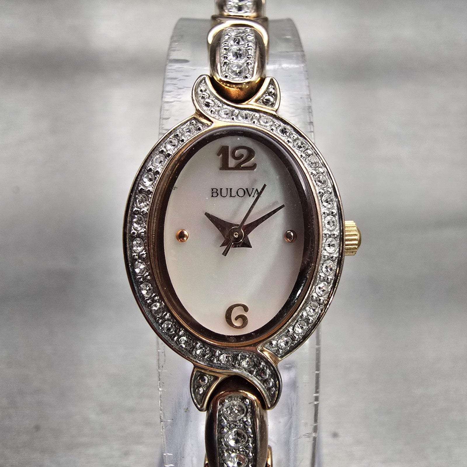 Bulova Watch Women 17mm MOP Dial Rose Gold Tone Gemmed Oval 98L200 New Battery0
