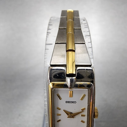 Seiko Watch Women 13mm White Dial Two Tone Rectangle 2E207479 New Battery C5674
