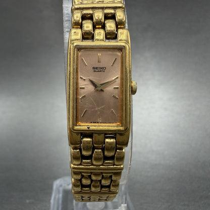 Seiko Tank Watch Women 13mm Pink Dial Gold Tone Rectangle 2E20-6951 New Battery0