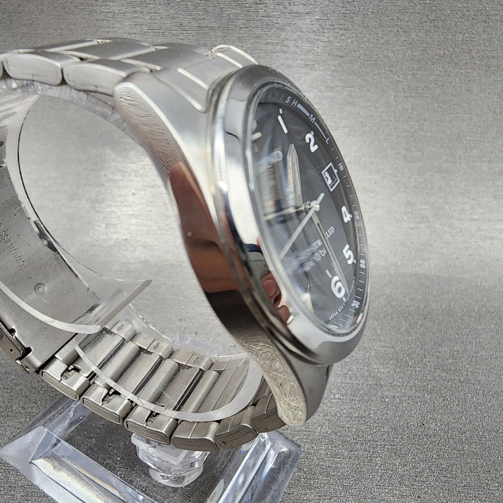 Reguno Watch Men 37mm Black Dial Silver Tone Date Solar H415T017274 Works5