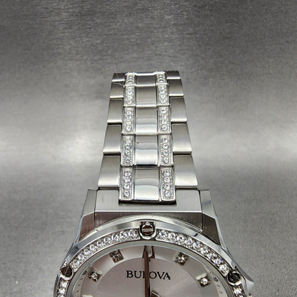 Bulova silver stainless steel watch with crystal-accented band and bezel, close-up view