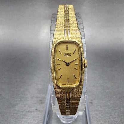 Seiko Tank Watch Women 13mm Gold Dial Gold Tone Rectangle 2E206310 New BatteryA0