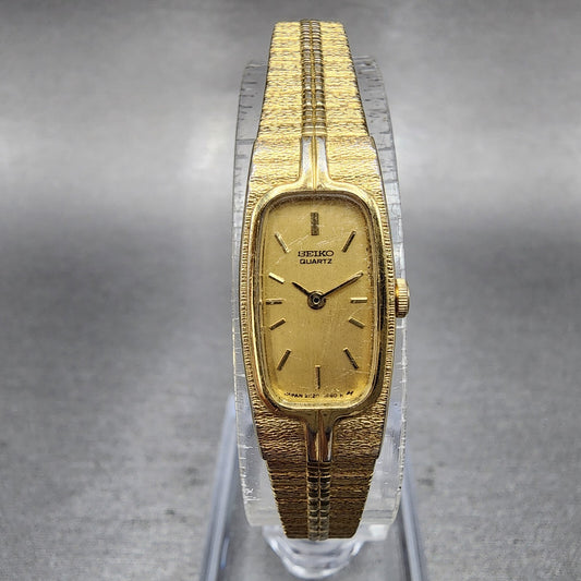 Seiko Tank Watch Women 13mm Gold Dial Gold Tone Rectangle 2E206310 New BatteryA0