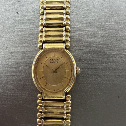 Seiko Watch Women 18mm Gold Dial Gold Tone Oval BROKEN BAND 2P205E29 New Batt1