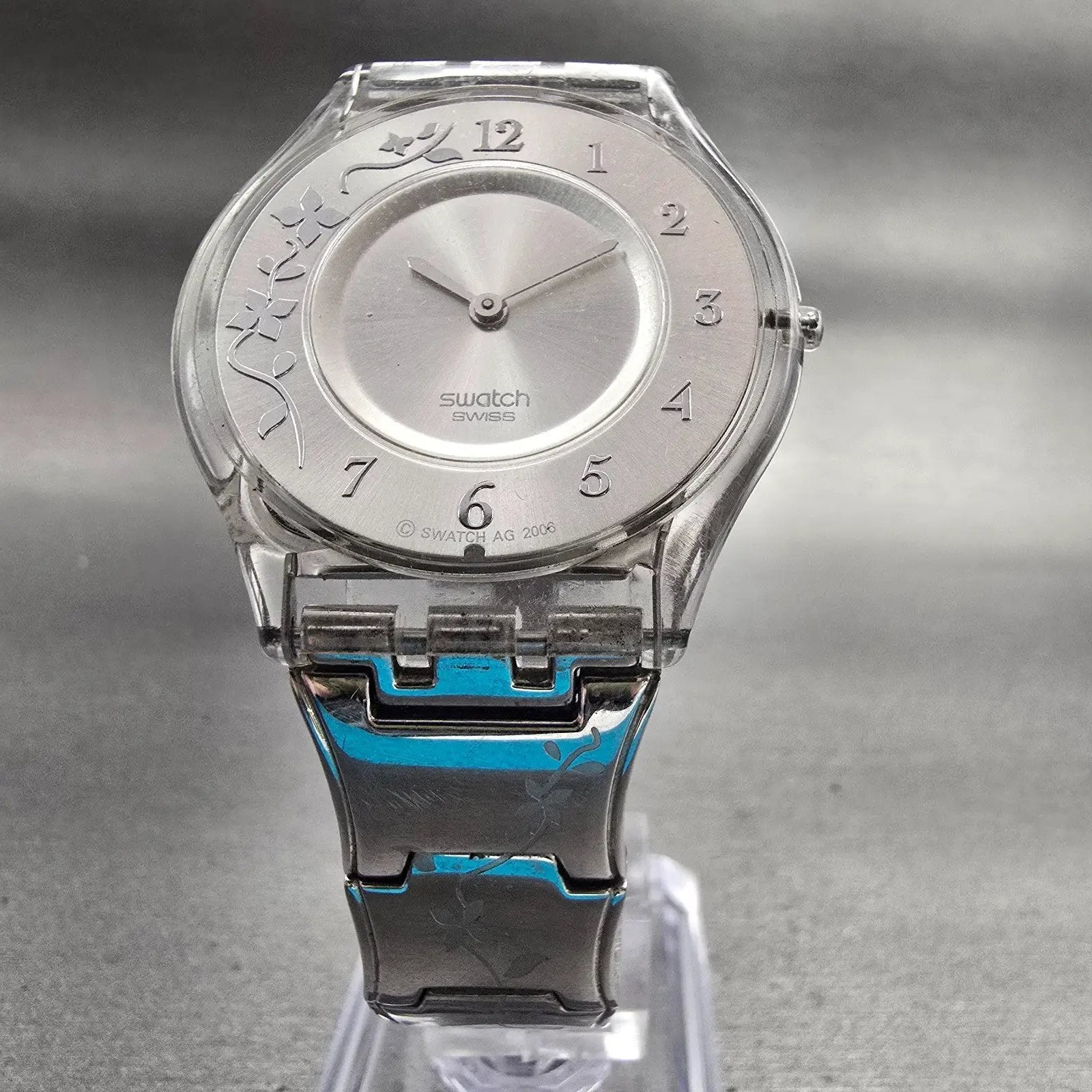 Swatch Skin CLIMBER FLOWERY Watch Women Silver Dial Clear Case SFK300G New Batt5