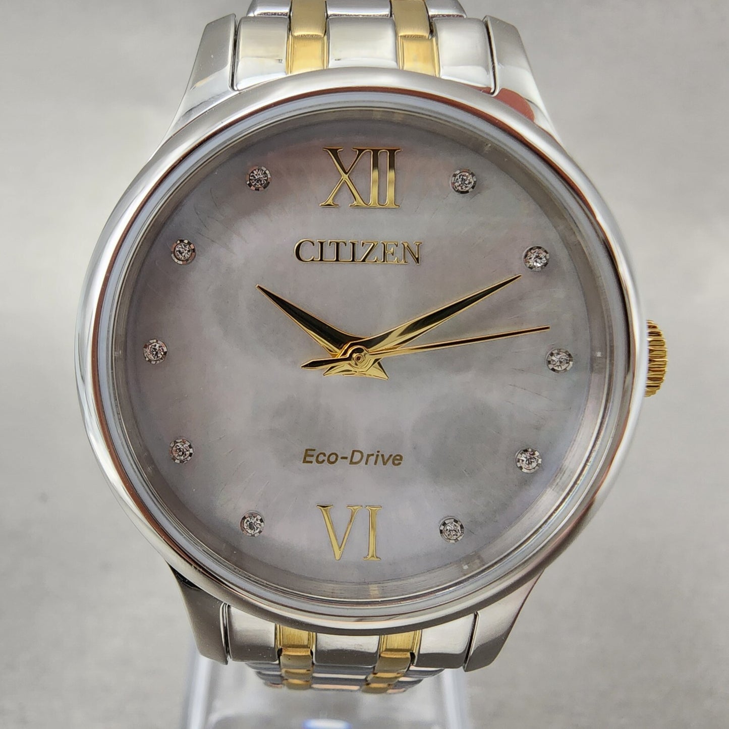 Citizen Eco-Drive Watch Women 31mm MOP Dial Two Tone Crystal Markers EM0894-50D
