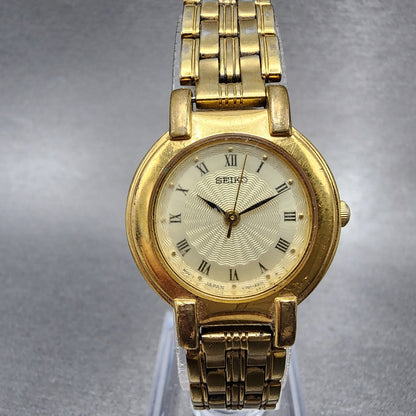 Seiko Watch Women 24mm Champagne Dial Gold Tone Round V7011781 New Battery VTG0