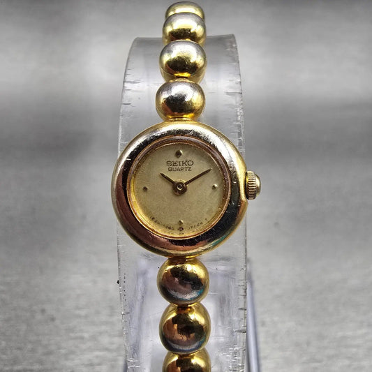 Seiko Watch Women 14mm Champagne Dial Gold Tone Round 1E20-0079 New Battery VTG0